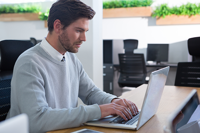 male-executive-working-on-his-laptop